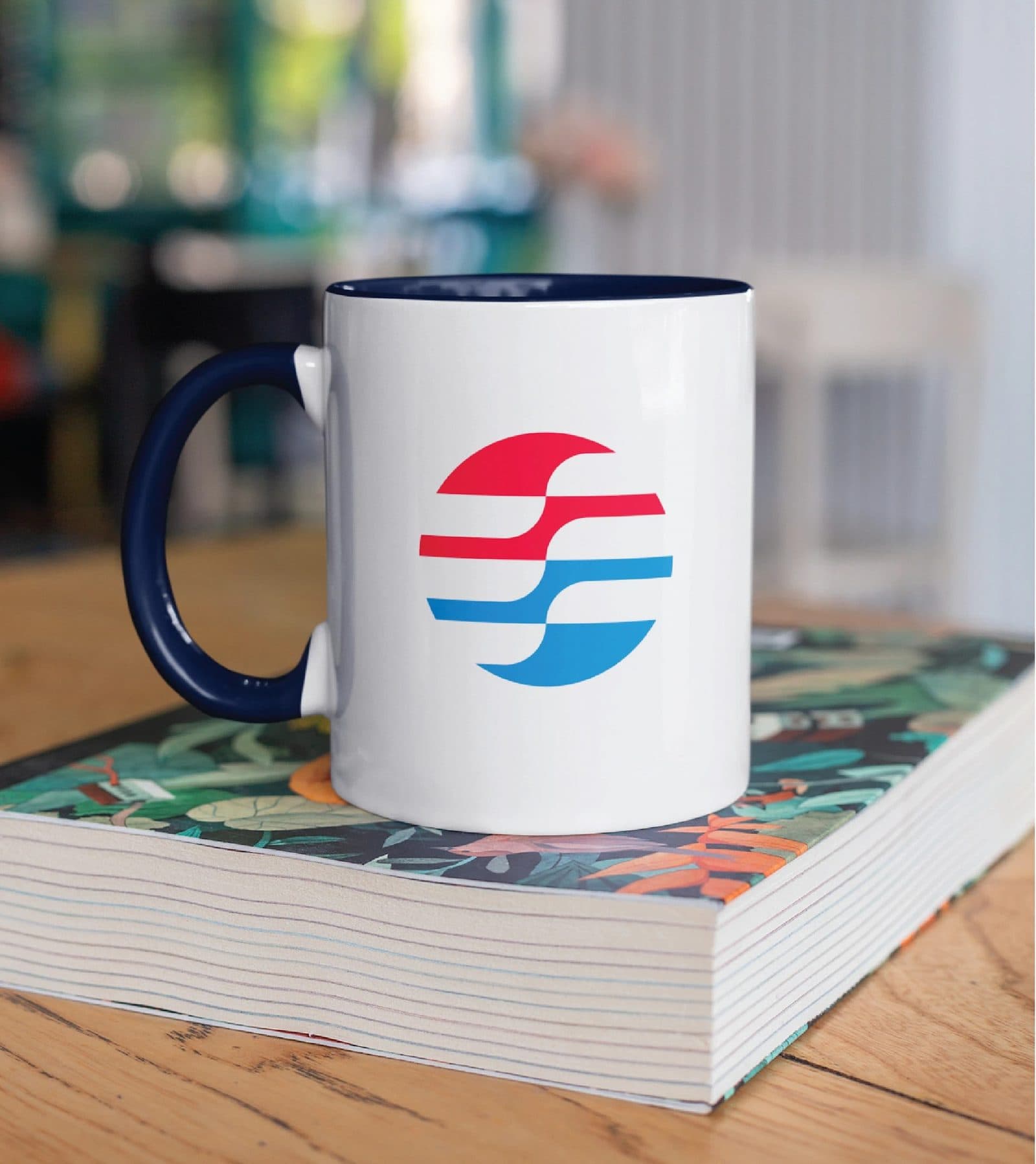 A branded ceramic mug carrying the airflow mark