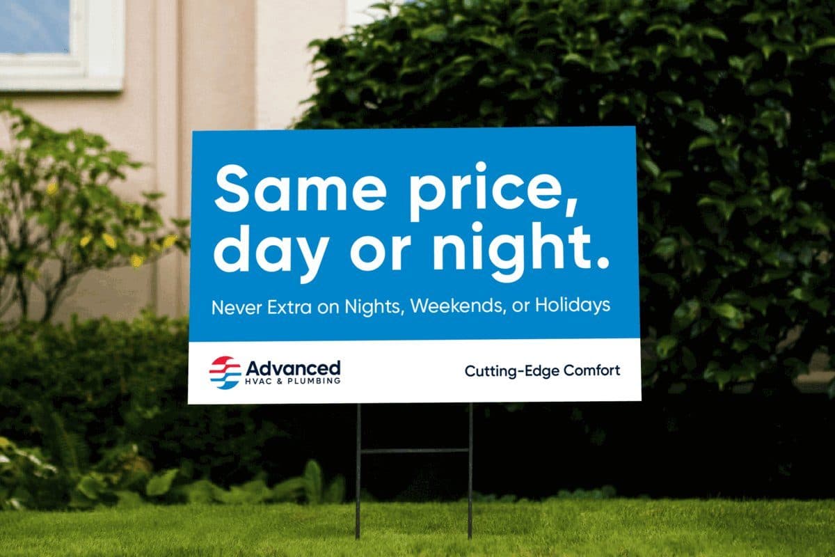 A blue lawn sign reading “Same price, day or night — never extra on nights, weekends, or holidays”